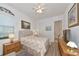 Cozy bedroom with a queen-size bed and built-in TV stand at 16219 Tradewind Ter, Bradenton, FL 34211