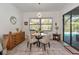 Bright dining room with glass table and pool view at 16219 Tradewind Ter, Bradenton, FL 34211