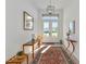 Bright and airy entryway with a rug, console table, and large mirror at 16219 Tradewind Ter, Bradenton, FL 34211