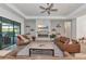 Open-concept living room with a modern fireplace and access to the backyard at 16219 Tradewind Ter, Bradenton, FL 34211