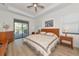 Main bedroom with king-size bed and private access to patio at 16219 Tradewind Ter, Bradenton, FL 34211