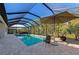 Relaxing pool and patio with screened enclosure and ample seating at 16219 Tradewind Ter, Bradenton, FL 34211