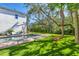 Expansive backyard with artificial turf and room for games at 1686 North Dr, Sarasota, FL 34239