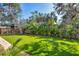 Landscaped backyard featuring lush greenery and privacy at 1686 North Dr, Sarasota, FL 34239