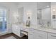 Double vanity bathroom with a large mirror and walk-in shower at 1686 North Dr, Sarasota, FL 34239