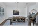 Formal dining room with wooden table, chandelier, and hardwood floors at 1686 North Dr, Sarasota, FL 34239