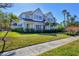 Two-story home with landscaped yard and walkway at 1686 North Dr, Sarasota, FL 34239