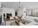 Open concept living room with white sectional sofa and a large chandelier at 1686 North Dr, Sarasota, FL 34239