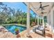 Inviting pool area with brick patio and comfortable seating at 1686 North Dr, Sarasota, FL 34239