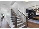 Modern staircase with dark wood and black metal railings at 1686 North Dr, Sarasota, FL 34239