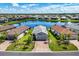 House and community view from above, near a lake at 17649 Northwood Pl, Bradenton, FL 34202