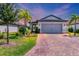 Charming house exterior with paver driveway at 17649 Northwood Pl, Bradenton, FL 34202