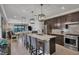 Modern kitchen with island, stainless steel appliances, and dark cabinetry at 17649 Northwood Pl, Bradenton, FL 34202