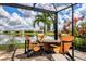 Relax by the fire pit on this screened-in patio at 17649 Northwood Pl, Bradenton, FL 34202