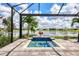 Private pool and spa with screened enclosure and lake view at 17649 Northwood Pl, Bradenton, FL 34202