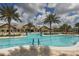 Resort-style pool with palm trees and lounge chairs at 17649 Northwood Pl, Bradenton, FL 34202