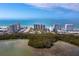 Aerial view of beachfront condos and lush landscape at 1800 Benjamin Franklin Dr # B408, Sarasota, FL 34236