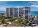 Oceanfront building with a balcony, partial ocean view at 1800 Benjamin Franklin Dr # B408, Sarasota, FL 34236