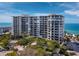 Oceanfront building with a balcony, partial ocean view at 1800 Benjamin Franklin Dr # B408, Sarasota, FL 34236