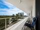 Spacious balcony with patio furniture, offering scenic views of the surroundings at 1800 Benjamin Franklin Dr # B408, Sarasota, FL 34236