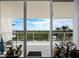 Spacious balcony with glass railings offering scenic views at 1800 Benjamin Franklin Dr # B408, Sarasota, FL 34236