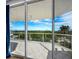 View from the balcony showcasing expansive water and treetop views at 1800 Benjamin Franklin Dr # B408, Sarasota, FL 34236