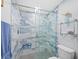 Modern bathroom with large marble shower at 1800 Benjamin Franklin Dr # B408, Sarasota, FL 34236