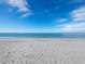 Scenic view of a tranquil beach with white sand and clear blue water at 1800 Benjamin Franklin Dr # B408, Sarasota, FL 34236