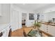 Bright bathroom featuring double sink, decorative tile, and convenient washer and dryer area at 1864 Clematis St, Sarasota, FL 34239