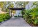 Paver driveway leading to the house and outdoor kitchen area at 1864 Clematis St, Sarasota, FL 34239