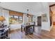 Elegant living room with hardwood floors, large windows, and a stylish decor, creating a welcoming space at 1864 Clematis St, Sarasota, FL 34239