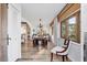 Open living room with hardwood floors, decorative furniture, and natural light from large windows at 1864 Clematis St, Sarasota, FL 34239