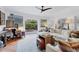 Bright living room with tiled floors, comfortable sofa, and doors leading to a courtyard at 1864 Clematis St, Sarasota, FL 34239