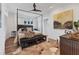 Main bedroom featuring hardwood floors, a canopy bed, and a neutral color palette at 1864 Clematis St, Sarasota, FL 34239