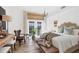 Stylish bedroom with wicker headboard, natural light and a cozy seating area at 1864 Clematis St, Sarasota, FL 34239