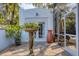 Exterior view of the home showcasing the outdoor patio area with decorative planters at 1864 Clematis St, Sarasota, FL 34239