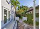 Enclosed patio with a deck, manicured landscaping, and privacy fence at 1864 Clematis St, Sarasota, FL 34239