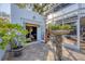 Patio view through open doors, revealing the patio's planters and seating, blending indoor/outdoor living at 1864 Clematis St, Sarasota, FL 34239