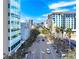 Aerial view of city street with modern buildings and lush landscaping at 1990 Main St # 6, Sarasota, FL 34236