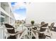 Private balcony with city views and seating for four at 1990 Main St # 6, Sarasota, FL 34236