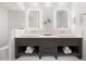 Modern bathroom with double vanity and marble flooring at 1990 Main St # 6, Sarasota, FL 34236