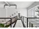 Loft-style hallway with exposed ductwork and a long rug at 1990 Main St # 6, Sarasota, FL 34236