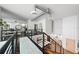 Loft-style hallway with exposed ductwork and modern decor at 1990 Main St # 6, Sarasota, FL 34236