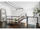 Loft-style hallway with dark hardwood floors and a bench at 1990 Main St # 6, Sarasota, FL 34236