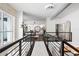 Upper level hallway with white walls and dark hardwood floors at 1990 Main St # 6, Sarasota, FL 34236