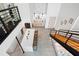 Modern kitchen island with white countertop and brown stools at 1990 Main St # 6, Sarasota, FL 34236