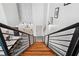 Modern wood staircase leading to the lower level at 1990 Main St # 6, Sarasota, FL 34236