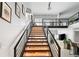 Modern staircase with wood steps and metal railing at 1990 Main St # 6, Sarasota, FL 34236