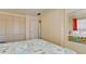 Spacious bedroom with mirrored closet doors and a comfortable bed at 2044 Canal Dr # M37, Bradenton, FL 34207