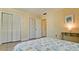 Well-lit bedroom with ample closet space and a comfortable bed at 2044 Canal Dr # M37, Bradenton, FL 34207